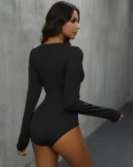 Back view of model wearing the lace trim v neck bodysuit