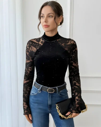 Front view of a black lace high neck bodysuit styled with blue jeans