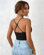 Black sheer lace bodysuit back view styled with blue jeans