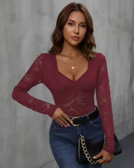 Burgundy long sleeve lace bodysuit styled with blue jeans