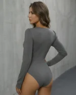 Back view of grey long sleeve lace bodysuit showing lace trimmed shoulders and slim fit